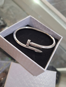 PULSERA CLAVO BRILLOS PLATEADA